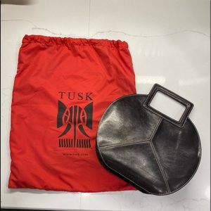 Tusk round leather handbag in black